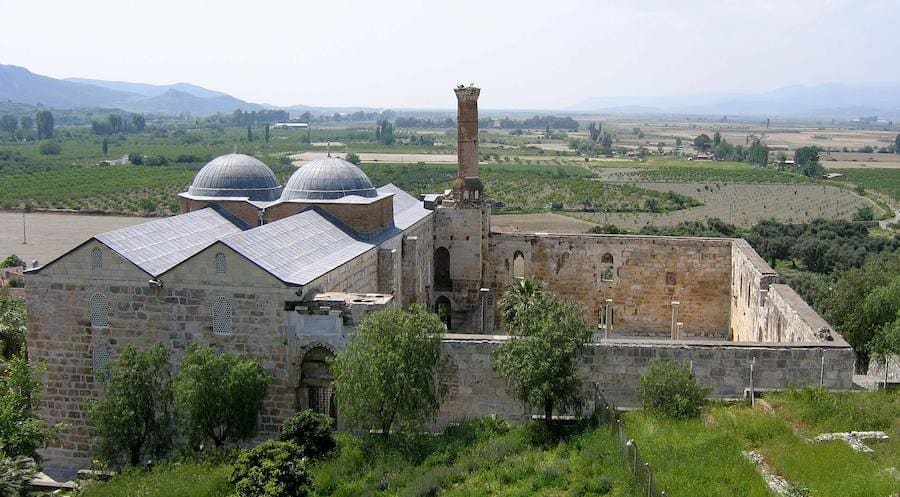 The two domes and ruined minaret of the 14th-century Isa Bey Mosque above the Selcuk plain